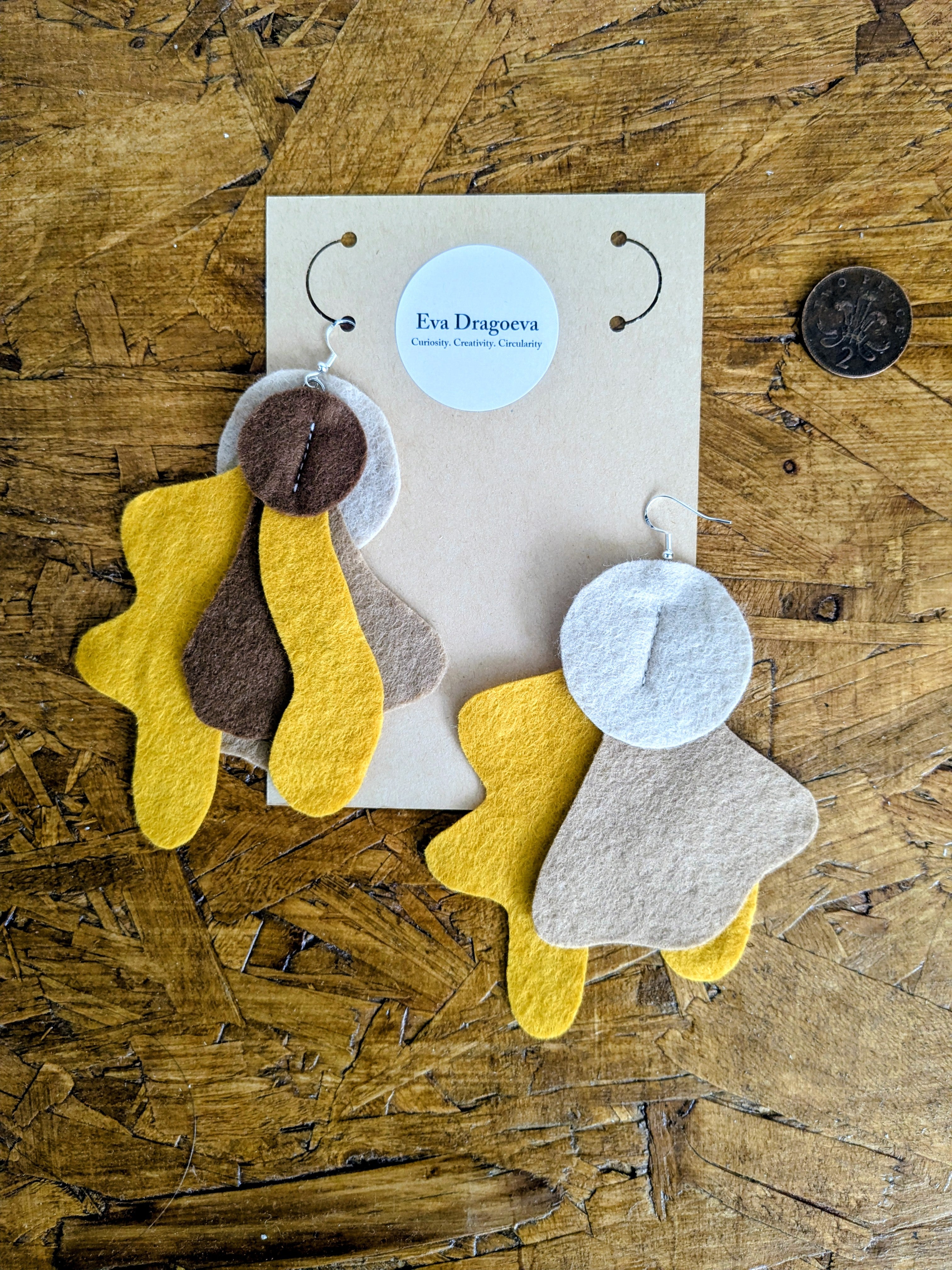 Large statement felt earrings in brown and orange