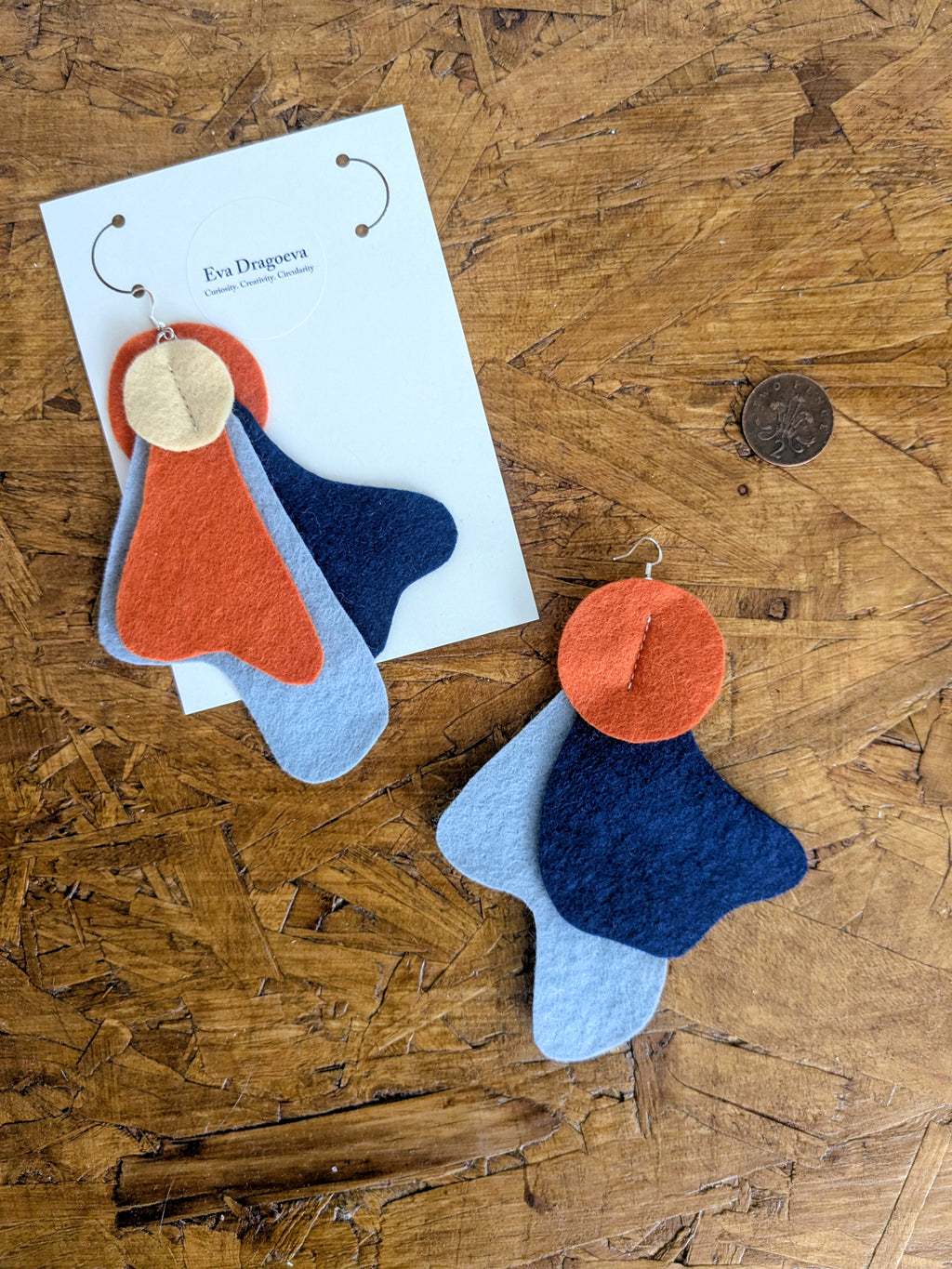 Large statement felt earrings in navy, yellow and orange