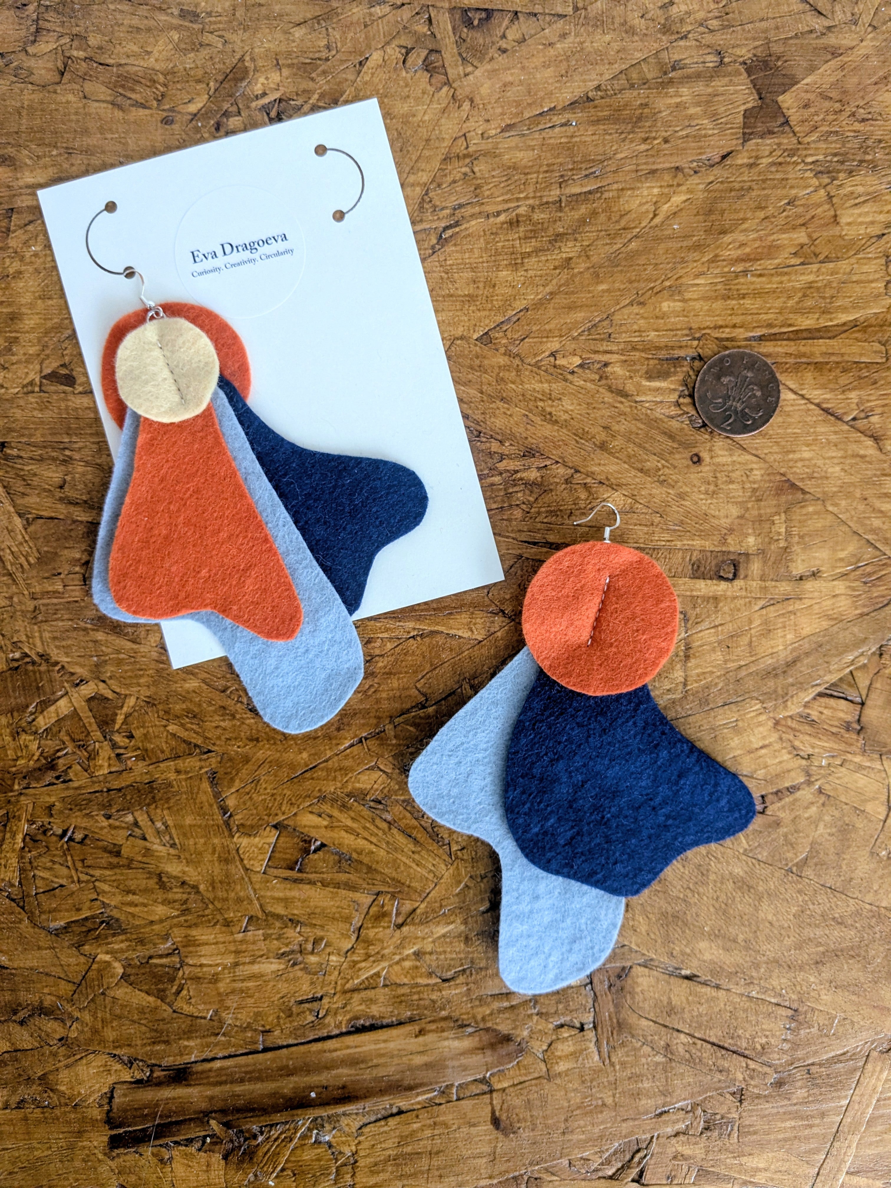 Large statement felt earrings in navy, yellow and orange