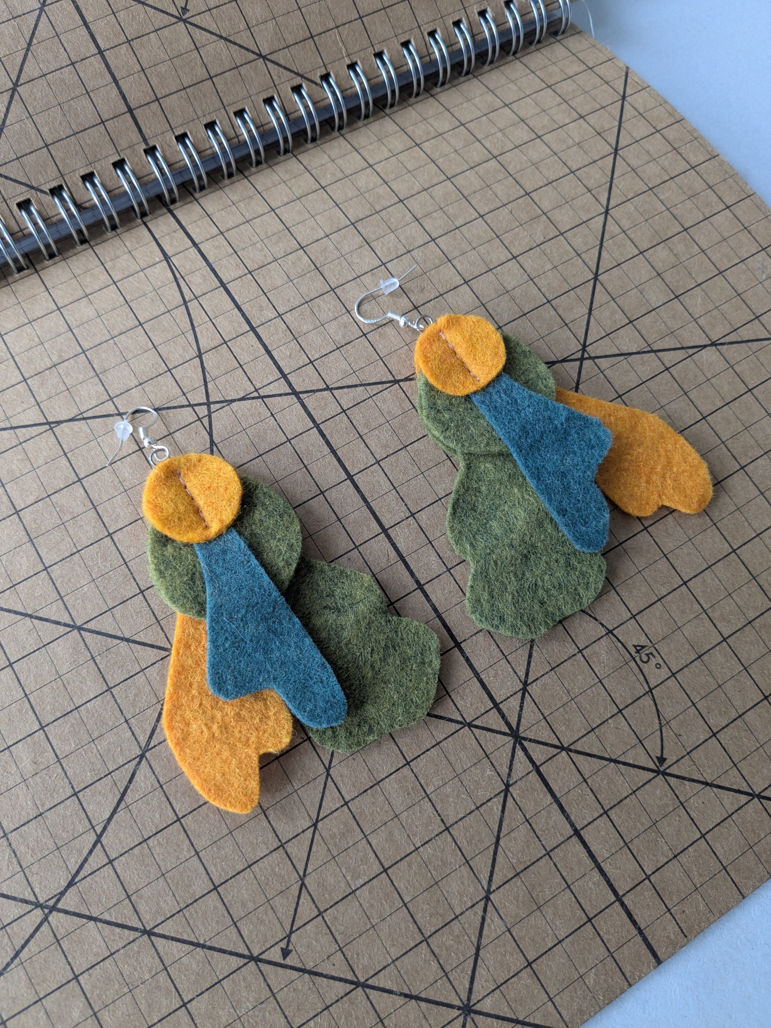 Heathered felt earrings in orange and green
