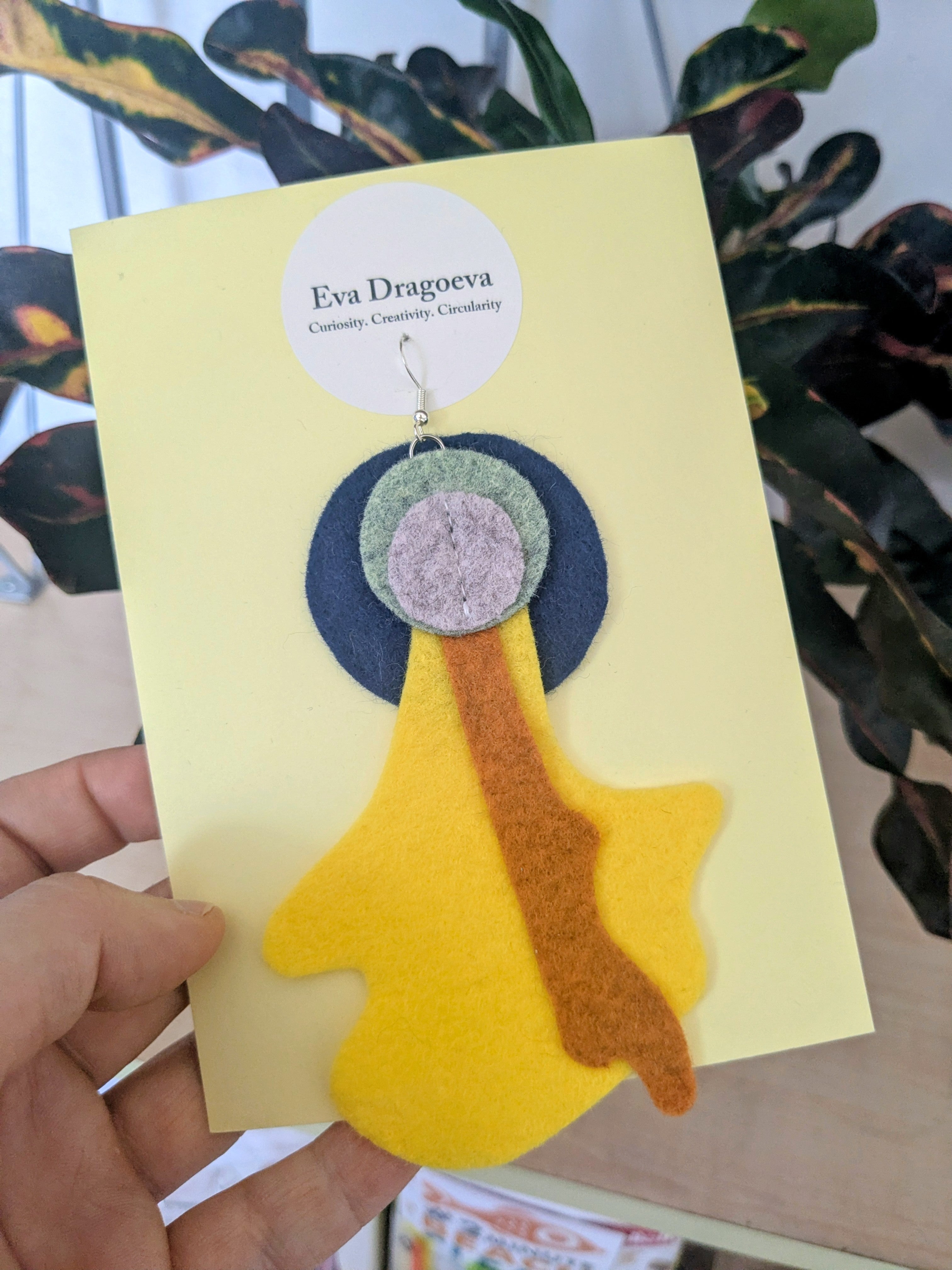 Single abstract felt earring in yellow, green, grey, navy and orange