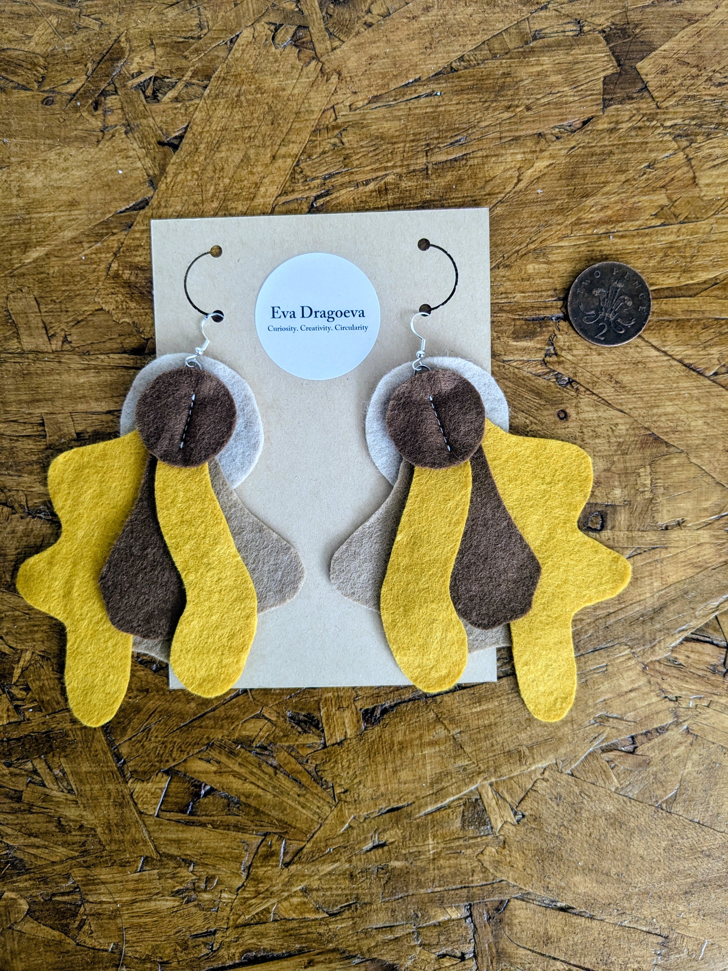 Large statement felt earrings in brown and orange