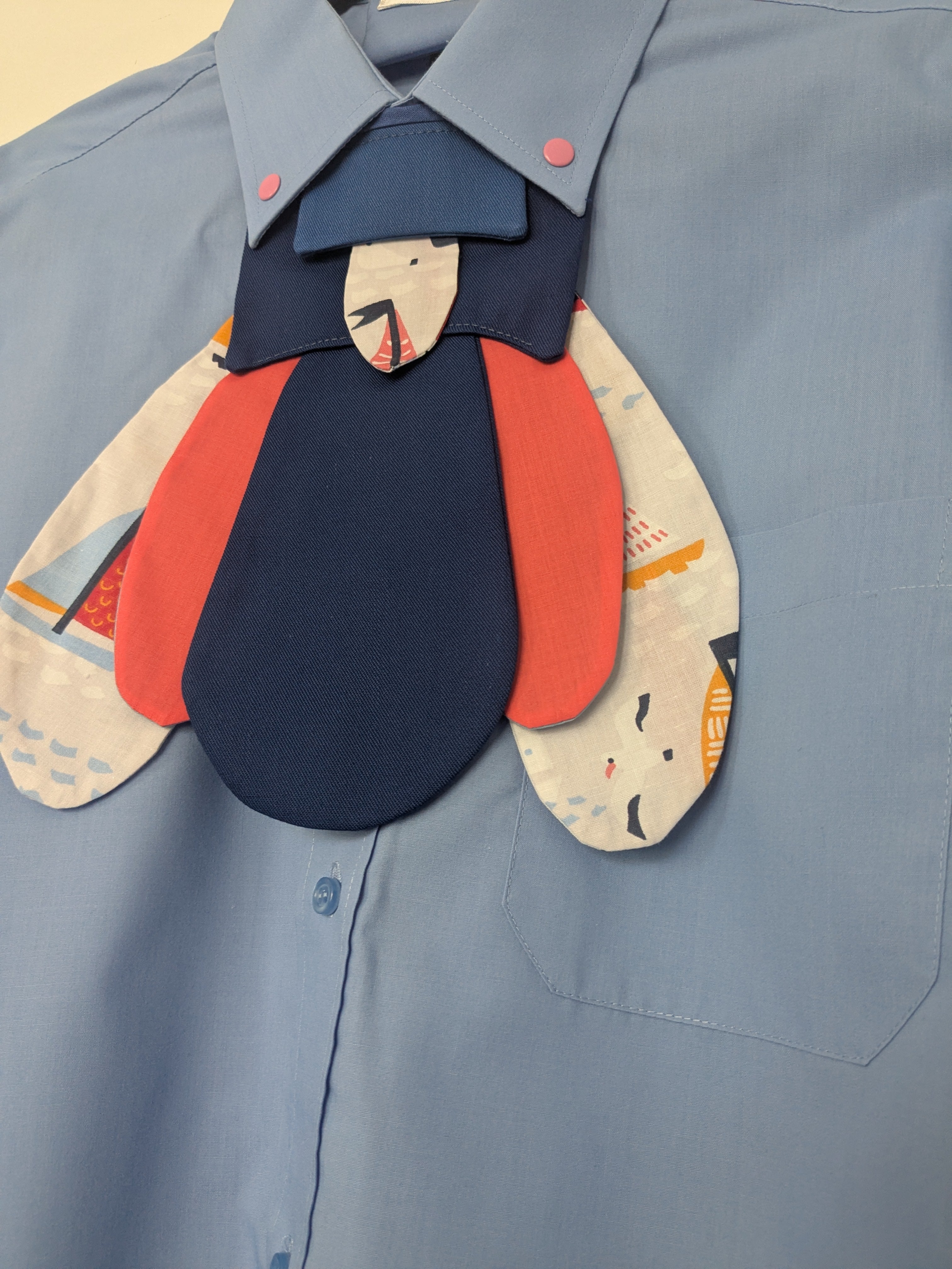Upcycled cropped blue shirt with pink clicks and futuristic nautical bug attachable
