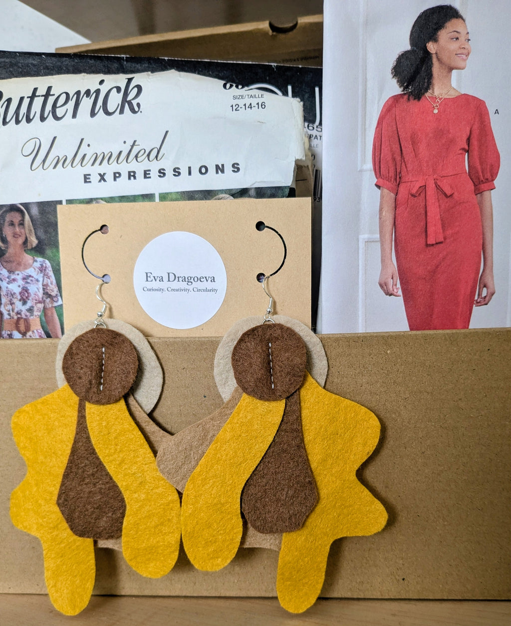 Large statement felt earrings in brown and orange