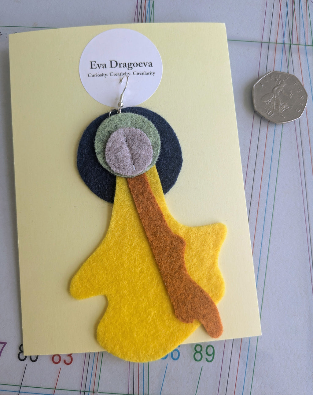 Single abstract felt earring in yellow, green, grey, navy and orange