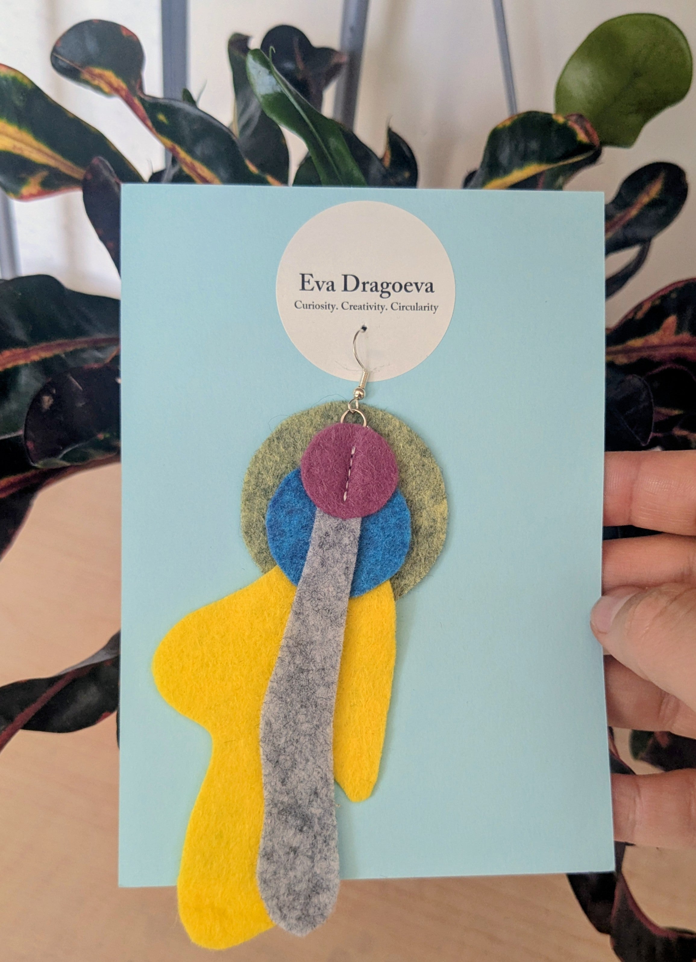Single abstract felt earring in yellow, purple, blue, green and grey