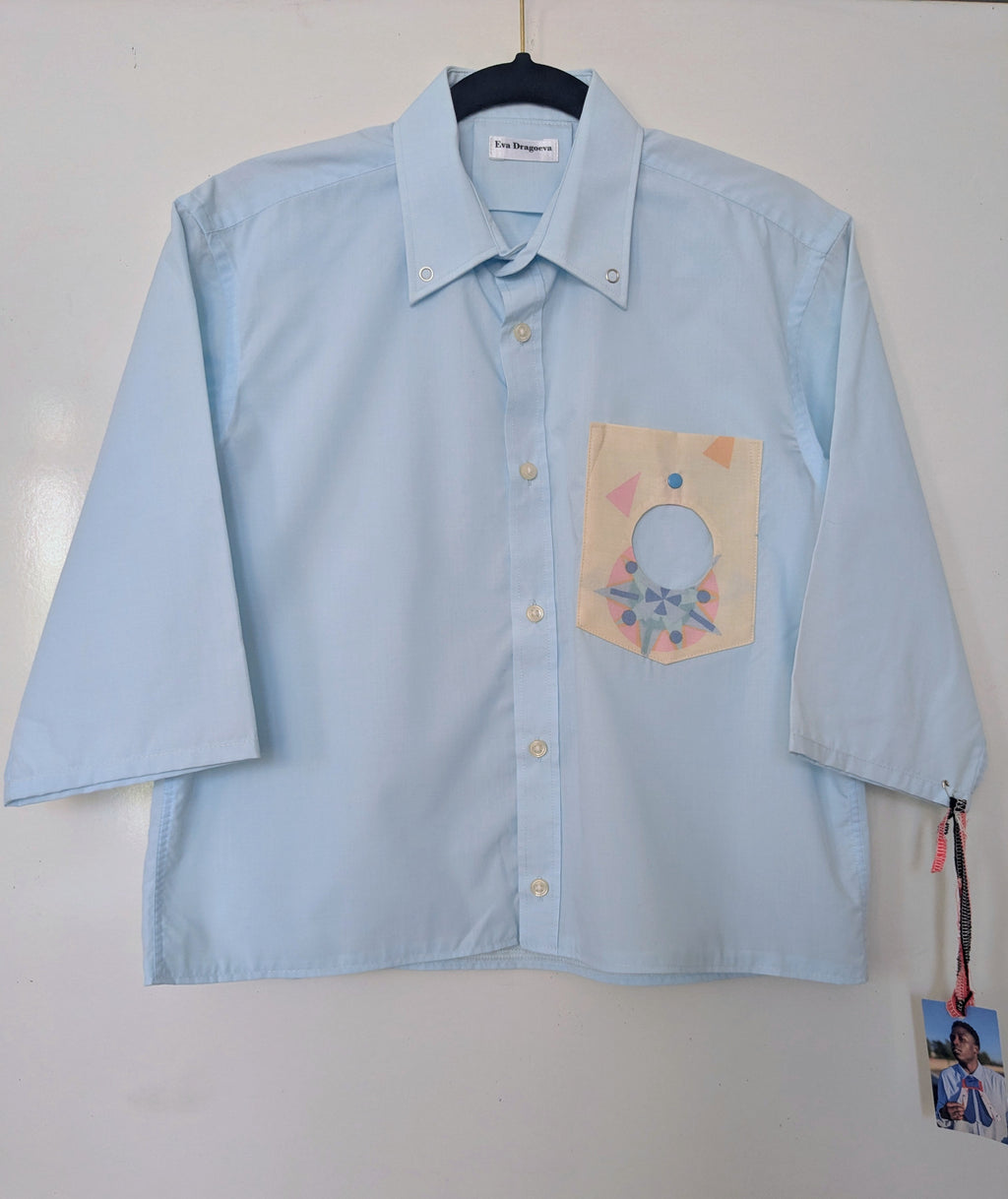 Upcycled cropped light blue shirt with a cool geometric pocket