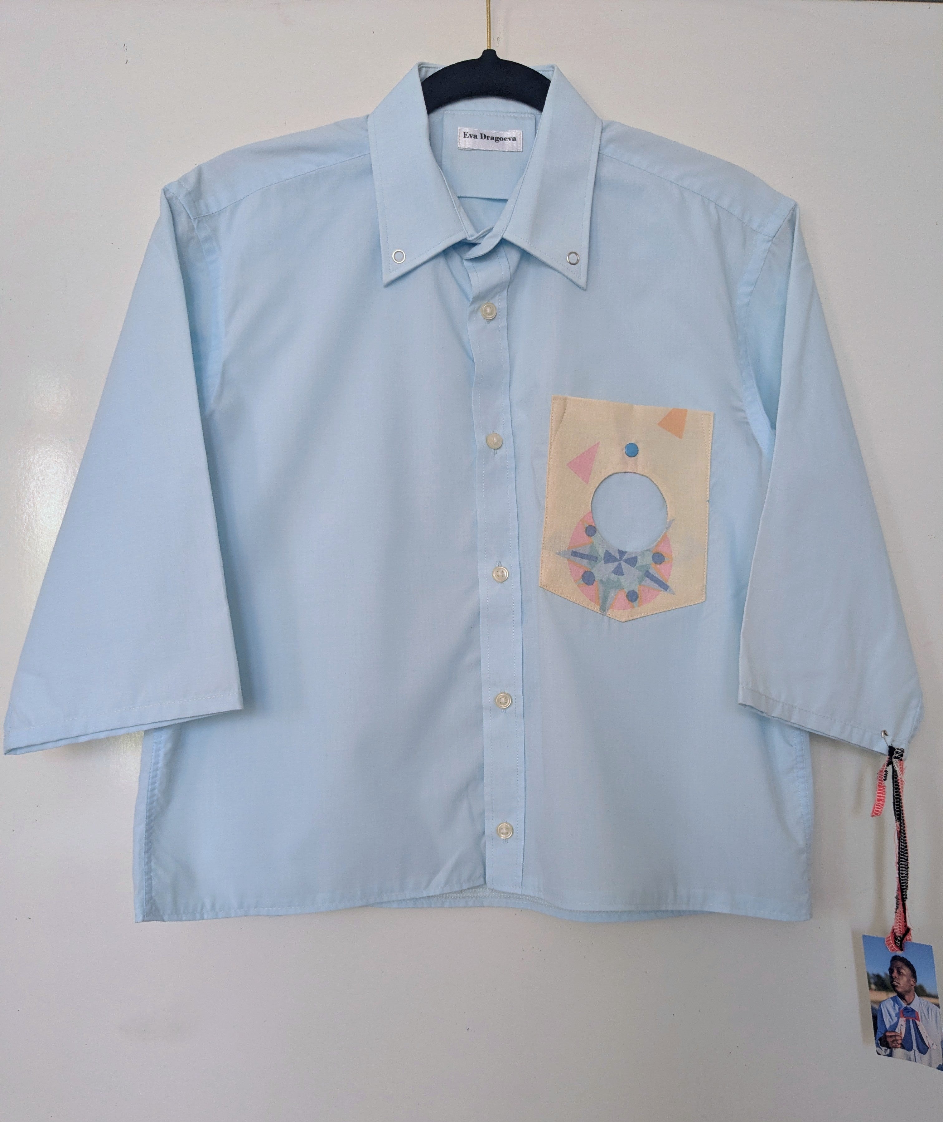 Upcycled cropped light blue shirt with a cool geometric pocket