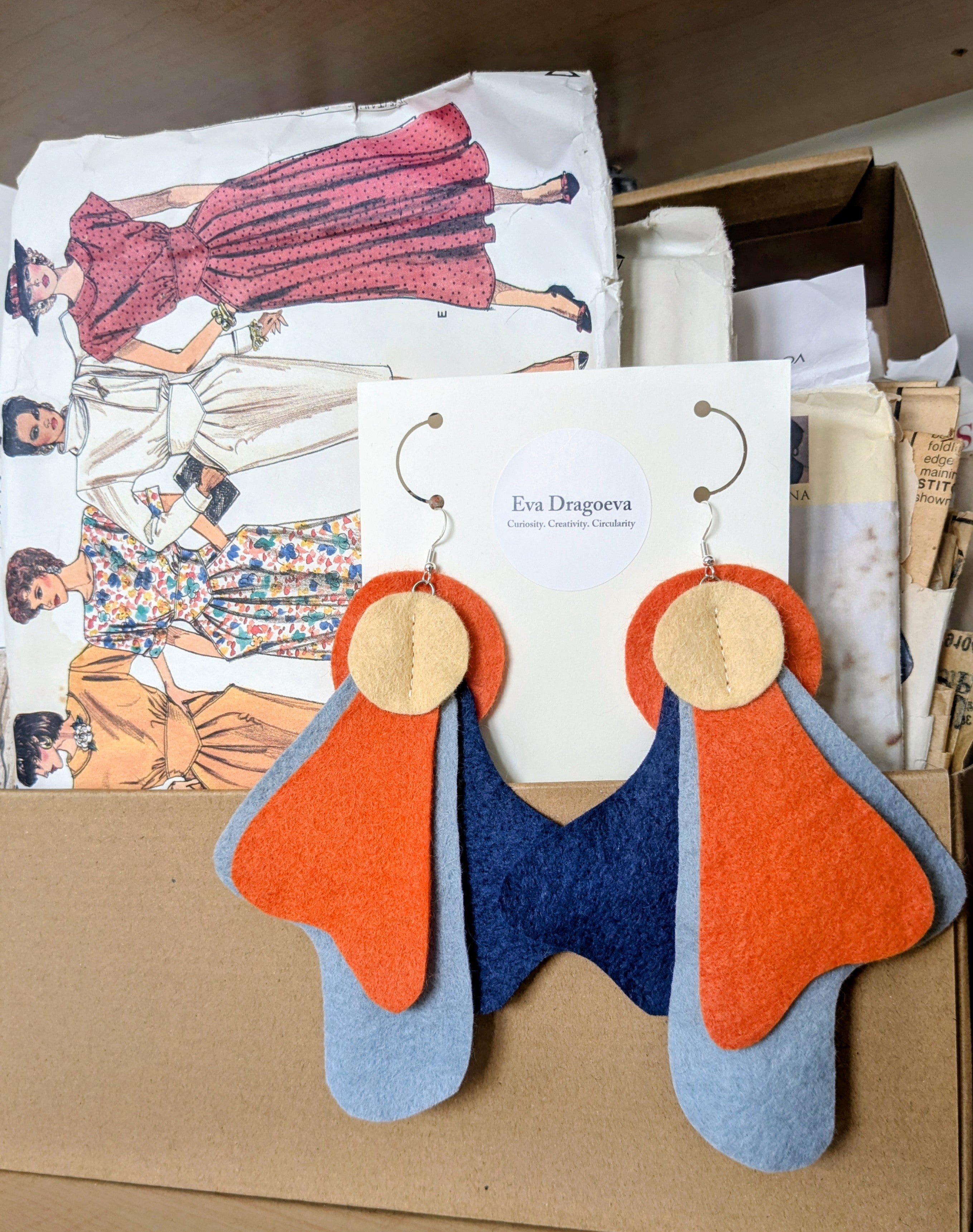 Large statement felt earrings in navy, yellow and orange