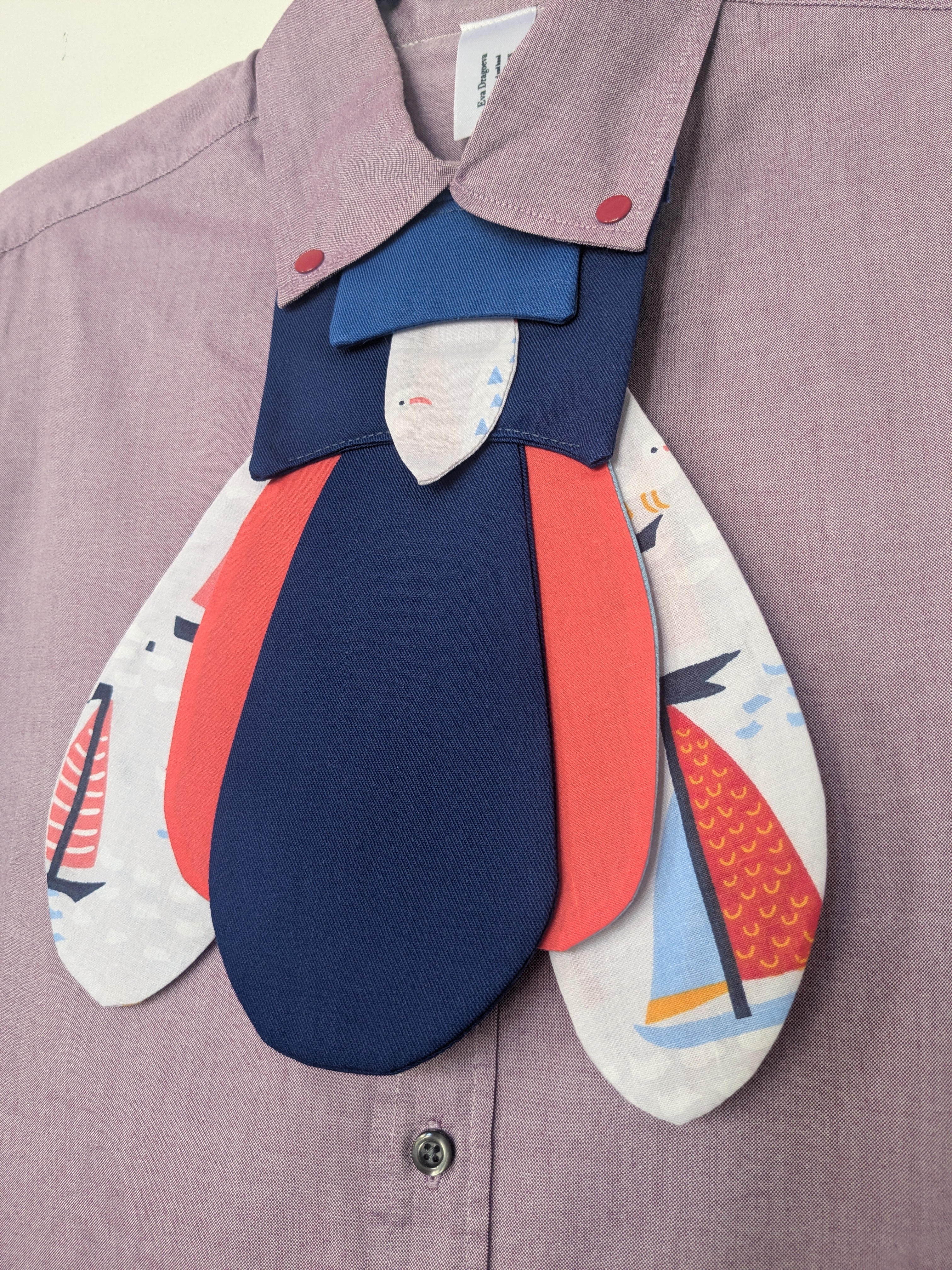 Upcycled cropped light pink shirt with red clicks and futuristic nautical bug attachable